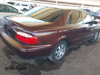 2002 Mazda 626 LX with VIN 1YVGF22C225291987, listed as a IAAI auction lot 41863018 with 111,362 mi miles. Bid and sale history available at carsss.com. Image 4.