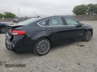 2017 Ford Fusion Titanium z VIN 3FA6P0SU5HR105415, wystawiony jako Copart lot #59779715 z przebiegiem 88 988 mil mil oraz Szkoda całkowita • Salvage title. Historia ofert i sprzedaży dostępna na DreamBid. Obrazek 3.