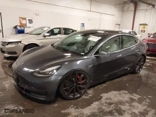 2020 Tesla Model 3 Performance with VIN 5YJ3E1EC3LF641768, listed as a IAAI auction lot 41542615 with 43,343 mi miles. Bid and sale history available at carsss.com. Image 2.