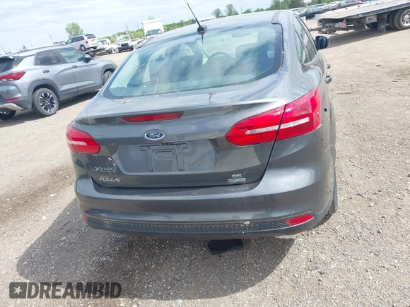 2018 Ford Focus SE z VIN 1FADP3FE5JL228583, wystawiony jako IAAI lot #42313614 z przebiegiem 84 240 mil mil oraz . Historia ofert i sprzedaży dostępna na DreamBid. Obrazek 16.