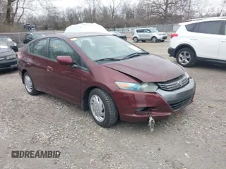 2011 Honda Insight LX z VIN JHMZE2H52BS004304, wystawiony jako IAAI lot #41827541 z przebiegiem 141 072 mil mil oraz . Historia ofert i sprzedaży dostępna na DreamBid. Obrazek 1.