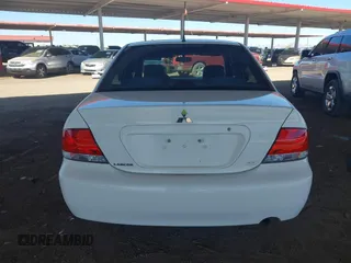 2004 Mitsubishi Lancer ES with VIN JA3AJ26E14U065498, listed as a IAAI auction lot 41887945 with 142,632 mi miles. Bid and sale history available at carsss.com. Image 16.