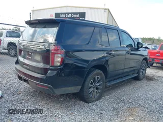 2021 Chevrolet Tahoe Z71 with VIN 1GNSKPKD8MR122190, listed as a IAAI auction lot 41587419 with 106,828 mi miles and . Bid and sale history available at DreamBid. Image 4.