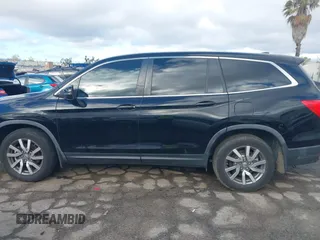2019 Honda Pilot EX-L with VIN 5FNYF5H51KB013763, listed as a IAAI auction lot 41711089 with 79,651 mi miles and . Bid and sale history available at DreamBid. Image 14.