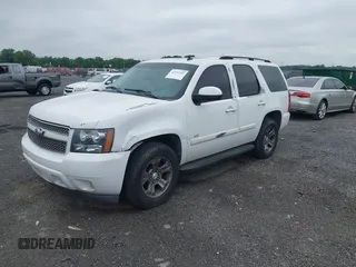 2007 Chevrolet Tahoe LTZ with VIN 1GNFK13007J149042, listed as a IAAI auction lot 42593189 with 216,791 mi miles and . Bid and sale history available at DreamBid. Image 2.