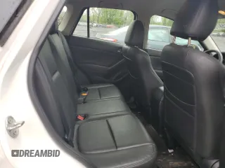 2016 Mazda CX-5 Sport z VIN JM3KE4BY2G0802376, wystawiony jako Copart lot #55976585 z przebiegiem 112 600 mil mil oraz Szkoda całkowita • Salvage title. Historia ofert i sprzedaży dostępna na DreamBid. Obrazek 10.