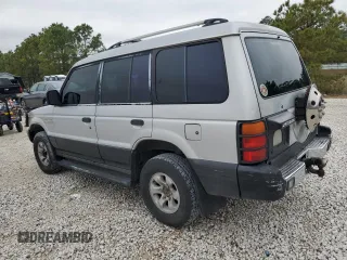 1995 Mitsubishi Montero z VIN JA4MR41H7SJ024208, wystawiony jako Copart lot #42971825 z przebiegiem 313 990 mil mil oraz Szkoda całkowita • Salvage title. Historia ofert i sprzedaży dostępna na DreamBid. Obrazek 2.