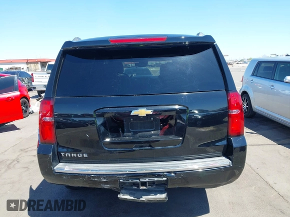 2015 Chevrolet Tahoe LTZ z VIN 1GNSKCKC7FR715512, wystawiony jako IAAI lot #42054583 z przebiegiem 106 941 mil mil oraz . Historia ofert i sprzedaży dostępna na DreamBid. Obrazek 16.