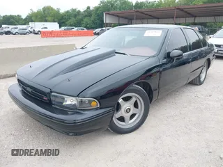 1994 Chevrolet Caprice LS z VIN 1G1BN52PXRR153486, wystawiony jako IAAI lot #42385035 z przebiegiem Nie podano mil oraz . Historia ofert i sprzedaży dostępna na DreamBid. Obrazek 2.