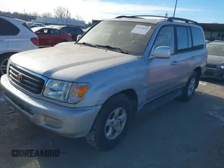1999 Toyota Land Cruiser with VIN JT3HT05J2X0038906, listed as a IAAI auction lot 41245814 with 1 mi miles. Bid and sale history available at carsss.com. Image 2.