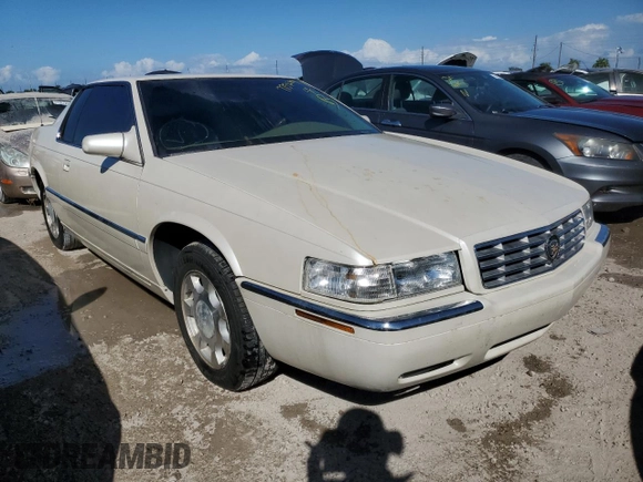 2000 Cadillac Eldorado z VIN 1G6EL12Y0YB704658, wystawiony jako Copart lot #77596814 z przebiegiem Nie podano mil oraz Nie do naprawy • Non repairable. Historia ofert i sprzedaży dostępna na DreamBid. Obrazek 4.