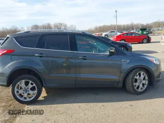 2015 Ford Escape Titanium with VIN 1FMCU9J90FUB58306, listed as a IAAI auction lot 41815151 with 136,835 mi miles. Bid and sale history available at carsss.com. Image 13.