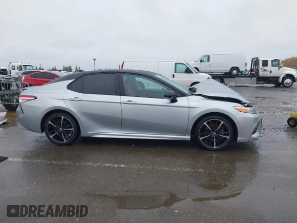 2020 Toyota Camry XSE with VIN 4T1K61AK1LU318098, listed as a IAAI auction lot 41097712 with 64,118 mi miles and . Bid and sale history available at DreamBid. Image 14.