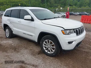 2021 Jeep Grand Cherokee Laredo X with VIN 1C4RJFAG1MC650687, listed as a IAAI auction lot 42181273 with 101,163 mi miles and . Bid and sale history available at DreamBid. Image 1.