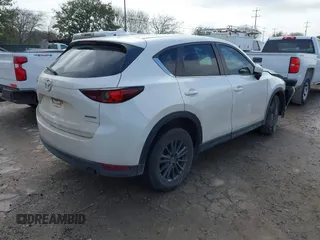 2020 Mazda CX-5 Touring with VIN JM3KFACM9L0771919, listed as a IAAI auction lot 41527773 with 93,417 mi miles and . Bid and sale history available at DreamBid. Image 4.