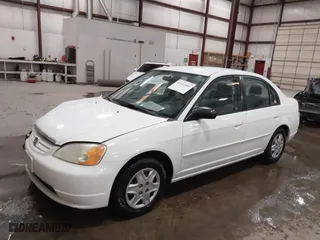2003 Honda Civic LX with VIN 2HGES16573H598145, listed as a IAAI auction lot 41651885 with 254,523 mi miles. Bid and sale history available at carsss.com. Image 2.