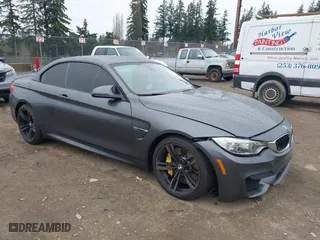 2015 BMW M4 with VIN WBS3U9C58FP967414, listed as a IAAI auction lot 41890511 with 56,710 mi miles. Bid and sale history available at carsss.com. Image 1.