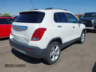 2015 Chevrolet Trax LTZ with VIN KL7CJTSBXFB236823, listed as a IAAI auction lot 42045817 with 138,930 mi miles. Bid and sale history available at carsss.com. Image 4.