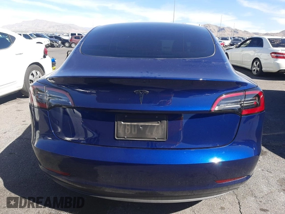 2023 Tesla Model 3 with VIN 5YJ3E1EA5PF652212, listed as a Copart auction lot 57348395 with 8,780 mi miles and Salvage title. Bid and sale history available at DreamBid. Image 6.