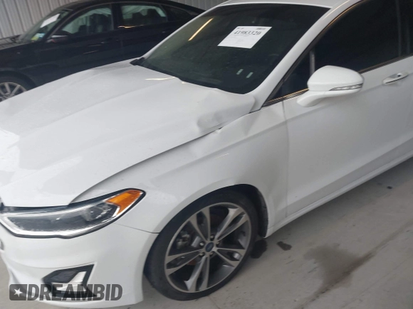 2019 Ford Fusion Titanium with VIN 3FA6P0K95KR271291, listed as a IAAI auction lot 41983320 with 71,962 mi miles and . Bid and sale history available at DreamBid. Image 21.