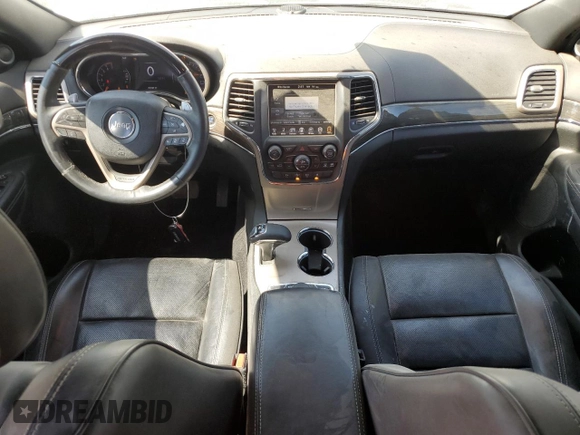 2014 Jeep Grand Cherokee Overland with VIN 1C4RJFCT7EC105296, listed as a Copart auction lot 50822775 with 180,067 mi miles and Salvage Title. Bid and sale history available at DreamBid. Image 8.