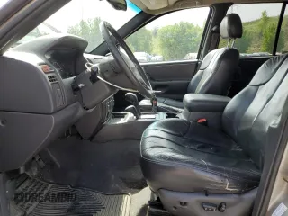 2000 Jeep Grand Cherokee Laredo with VIN 1J4GW48N1YC324356, listed as a Copart auction lot 62011305 with 242,322 mi miles and Salvage title. Bid and sale history available at DreamBid. Image 7.
