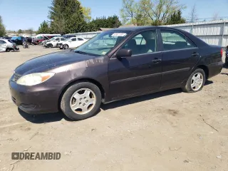 2003 Toyota Camry LE z VIN 4T1BF30K03U559390, wystawiony jako Copart lot #53507185 z przebiegiem 61 774 mil mil oraz Czysty tytuł • Clean title. Historia ofert i sprzedaży dostępna na DreamBid. Obrazek 1.