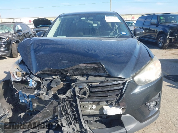 2016 Mazda CX-5 Touring with VIN JM3KE2CY6G0808992, listed as a IAAI auction lot 40969655 with 132,513 mi miles. Bid and sale history available at carsss.com. Image 12.