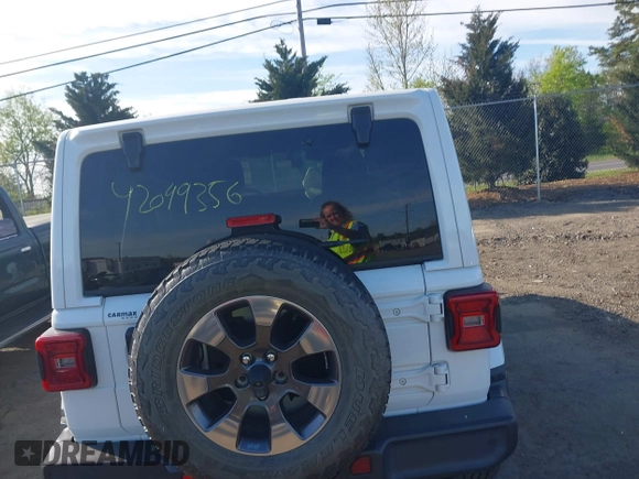 2018 Jeep Wrangler Unlimited Sahara z VIN 1C4HJXEG9JW227829, wystawiony jako IAAI lot #42099356 z przebiegiem 130 259 mil mil oraz . Historia ofert i sprzedaży dostępna na DreamBid. Obrazek 16.