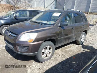 2010 Kia Sportage LX with VIN KNDKGCA32A7669068, listed as a IAAI auction lot 41783154 with 168,226 mi miles and . Bid and sale history available at carsss.com. Image 2.
