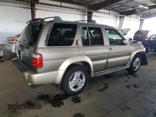 2001 Infiniti QX4 with VIN JNRDR09X21W204448, listed as a Copart auction lot 82619574 with 114,520 mi miles and Salvage Title. Bid and sale history available at DreamBid. Image 3.