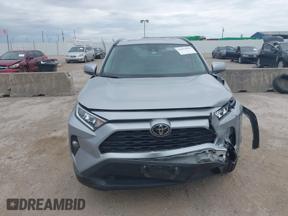 2020 Toyota RAV4 XLE with VIN 2T3W1RFV4LW094687, listed as a IAAI auction lot 42652039 with 56,693 mi miles and . Bid and sale history available at DreamBid. Image 12.