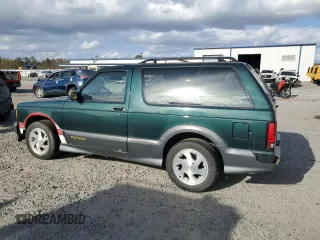 1993 GMC Jimmy z VIN 1GDCT18Z9P0810178, wystawiony jako Copart lot #79442614 z przebiegiem 19 514 mil mil oraz Szkoda całkowita • Salvage title. Historia ofert i sprzedaży dostępna na DreamBid. Obrazek 2.