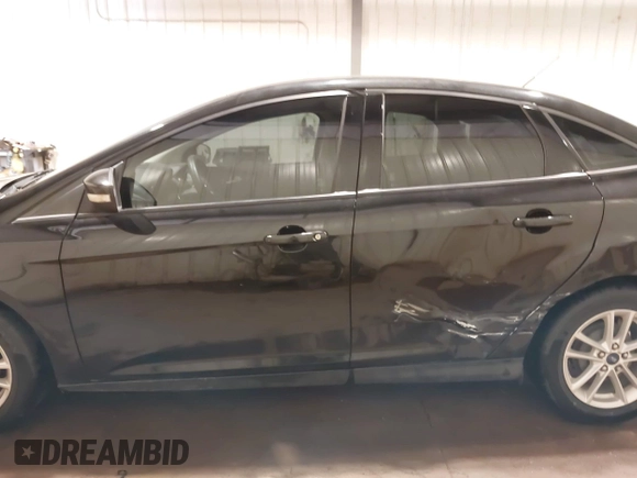 2015 Ford Focus SE with VIN 1FADP3F29FL203084, listed as a IAAI auction lot 42357973 with 99,002 mi miles and . Bid and sale history available at DreamBid. Image 14.