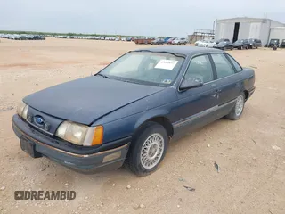 1987 Ford Taurus z VIN 1FABP53U0HA101874, wystawiony jako IAAI lot #42619153 z przebiegiem Nie podano mil oraz . Historia ofert i sprzedaży dostępna na DreamBid. Obrazek 2.