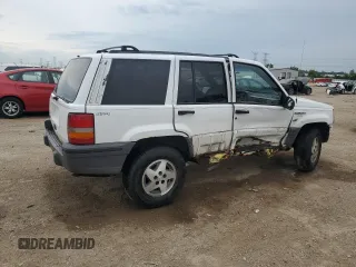 1995 Jeep Grand Cherokee Laredo z VIN 1J4GZ58S2SC578183, wystawiony jako Copart lot #61665955 z przebiegiem 341 135 mil mil oraz Szkoda całkowita • Salvage title. Historia ofert i sprzedaży dostępna na DreamBid. Obrazek 3.