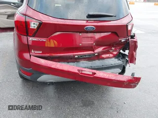 2019 Ford Escape Titanium z VIN 1FMCU9J99KUA18880, wystawiony jako IAAI lot #40830436 z przebiegiem 117 499 mil mil oraz . Historia ofert i sprzedaży dostępna na DreamBid. Obrazek 6.