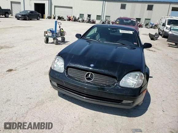 1999 Mercedes-Benz SLK-Class with VIN WDBKK47F5XF129037, listed as a Copart auction lot 68842504 with 74,397 mi miles and Salvage Title. Bid and sale history available at carsss.com. Image 10.