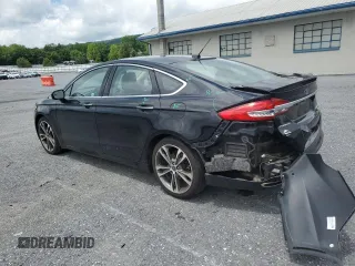 2017 Ford Fusion Titanium z VIN 3FA6P0K92HR192881, wystawiony jako Copart lot #61190515 z przebiegiem 109 834 mil mil oraz Szkoda całkowita • Salvage title. Historia ofert i sprzedaży dostępna na DreamBid. Obrazek 2.