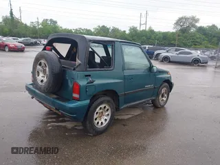 1996 Chevrolet Tracker z VIN 2CNBJ1860T6910906, wystawiony jako IAAI lot #42257309 z przebiegiem 206 888 mil mil oraz . Historia ofert i sprzedaży dostępna na DreamBid. Obrazek 4.