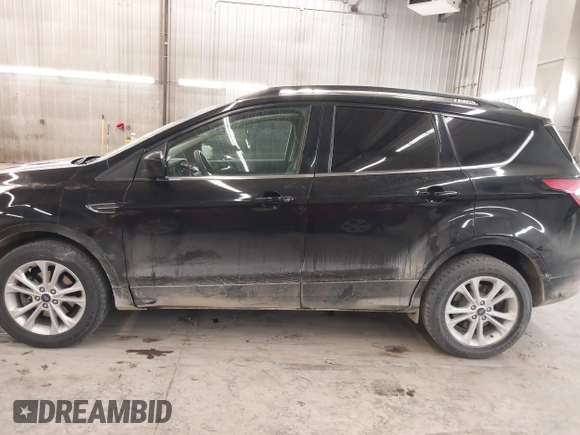 2018 Ford Escape SE z VIN 1FMCU9GD0JUC25636, wystawiony jako IAAI lot #40996760 z przebiegiem 70 097 mil mil oraz . Historia ofert i sprzedaży dostępna na DreamBid. Obrazek 15.