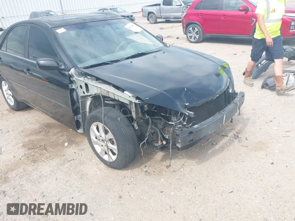 2005 Toyota Camry LE with VIN 4T1BF32K15U091945, listed as a IAAI auction lot 42124503 with 212,951 mi miles and . Bid and sale history available at DreamBid. Image 18.