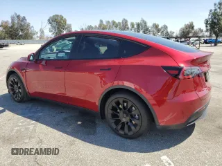 2024 Tesla Model Y Long Range with VIN 7SAYGAEE0RF016323, listed as a Copart auction lot 50253205 with 12,490 mi miles and Salvage title. Bid and sale history available at DreamBid. Image 2.