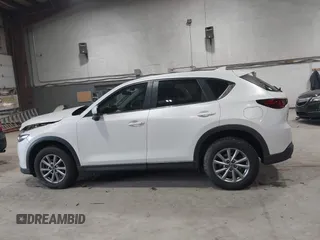 2023 Mazda CX-5 2.5 S with VIN JM3KFBAMXP0153362, listed as a IAAI auction lot 41875188 with 57,648 mi miles. Bid and sale history available at carsss.com. Image 14.