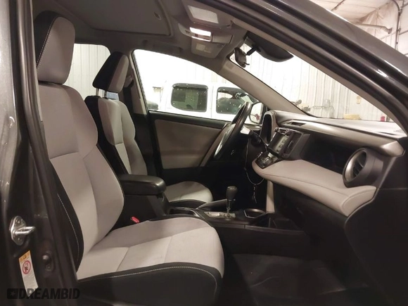 2018 Toyota RAV4 XLE with VIN 2T3RFREV4JW835563, listed as a IAAI auction lot 41431755 with 106,983 mi miles. Bid and sale history available at carsss.com. Image 5.