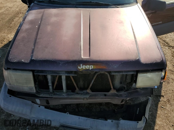1997 Jeep Grand Cherokee Laredo with VIN 1J4GZ58S9VC687969, listed as a Copart auction lot 79930814 with 0 mi miles and Salvage Title. Bid and sale history available at carsss.com. Image 12.