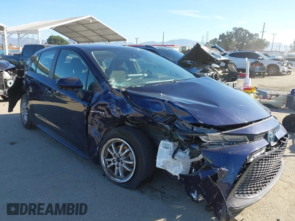 2021 Toyota Corolla Hybrid LE with VIN JTDEAMDEXMJ018828, listed as a IAAI auction lot 41633192 with 63,302 mi miles. Bid and sale history available at carsss.com. Image 1.