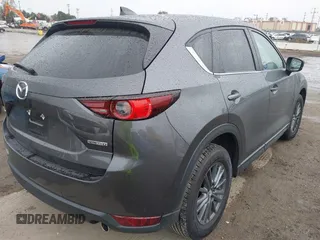 2021 Mazda CX-5 Touring with VIN JM3KFACM6M0480487, listed as a IAAI auction lot 41731646 with 26,951 mi miles and . Bid and sale history available at carsss.com. Image 4.