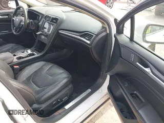 2017 Ford Fusion Titanium z VIN 3FA6P0K92HR396113, wystawiony jako IAAI lot #42402969 z przebiegiem 185 620 mil mil oraz . Historia ofert i sprzedaży dostępna na DreamBid. Obrazek 5.