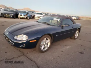 1999 Jaguar XK with VIN SAJGX2043XC040382, listed as a Copart auction lot 85751454 with 137,370 mi miles and Salvage Title. Bid and sale history available at DreamBid. Image 1.